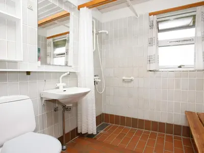 a bathroom with a toilet and a sink at Seaside escape in Hanstholm in Hanstholm