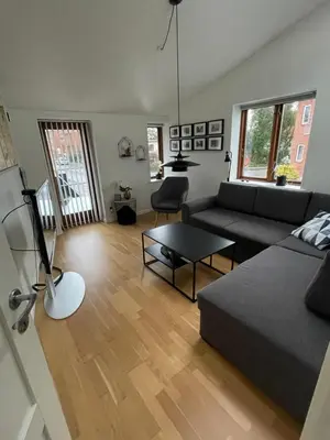a living room with a couch and a table at Marieshus in Holstebro