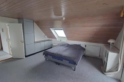 a small room with a bed and a window at Villa Nida in Ranum