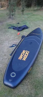 a blue surfboard sitting on top of the grass at Villa Nida in Ranum