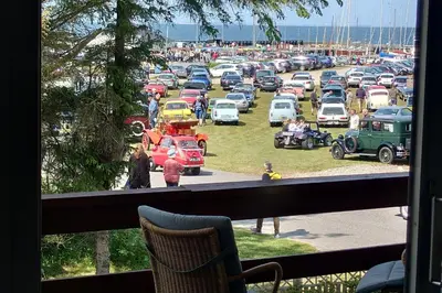 a bunch of cars parked in a parking lot at Villa Nida in Ranum
