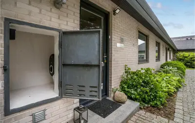 a door that is open on the side of a house at Awesome Home In Holstebro With Kitchen in Holstebro