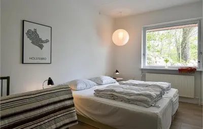 a bedroom with a bed and a window at Awesome Home In Holstebro With Kitchen in Holstebro