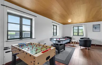a room with a foosball table and a pool table at Gorgeous Home In Hanstholm With Kitchen in Hanstholm