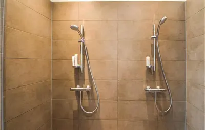 a shower with two shower heads in a bathroom at Pet Friendly Home In Vinderup in Vinderup