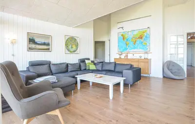 a living room with a couch and a table at Pet Friendly Home In Vinderup in Vinderup