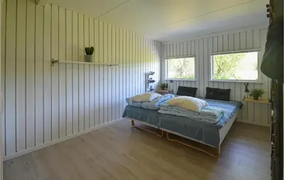 a bedroom with a bed in a room at Gorgeous Home In Fjerritslev in Fjerritslev