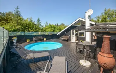 a deck with a swimming pool on a house at Gorgeous Home In Fjerritslev in Fjerritslev