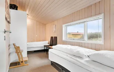 a bedroom with a bed and a window at Gorgeous Home In Harboøre With Wifi in Harboør