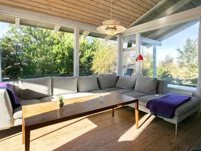 a living room with a couch and a table at Charming Beach Retreat - By Traum Ferienwohnungen in Fjerritslev
