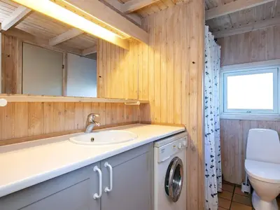 a bathroom with a sink and a toilet at Charming Beach Retreat - By Traum Ferienwohnungen in Fjerritslev