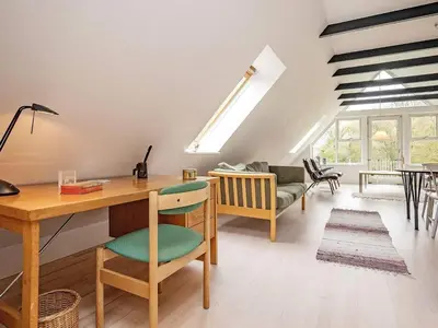 a home office with a desk and a table at 8 person holiday home in Fur in Fur