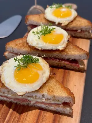 a bunch of sandwiches with eggs on a cutting board at Hotel Steenbergs in Nykøbing Mors