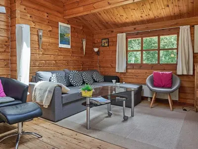 a living room with a couch and two chairs at Cozy Coastal Cottage Retreat-By Traum in Sindrup
