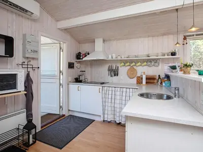 a kitchen with a sink and a counter top at Bright Coastal Retreat in Vorupor-By Traum in Thisted