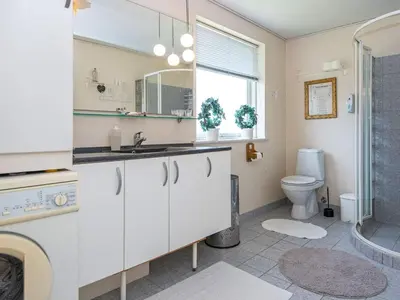a bathroom with a sink and a toilet at Secluded Forest Haven-By Traum in Løgsted