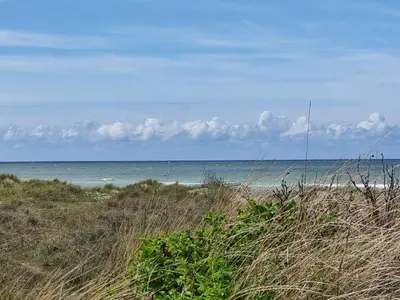 a view of the ocean from a sandy beach at 18 person holiday home in Fjerritslev in Fjerritslev