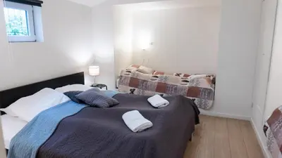 a bedroom with a bed with two pillows on it at Hilmor's Lejligheder in Viborg