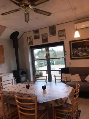a dining room table with two birds sitting on top of it at KristiansBorg in Nykøbing Mors