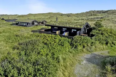 an aerial view of a house on a hill at Cozy house with stunning sea views in Pandrup