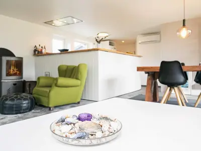 a bowl of shells sitting on a table in a living room at 6 person holiday home in Blokhus in Blokhus