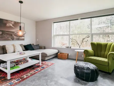 a living room with a couch and a table at 6 person holiday home in Blokhus in Blokhus