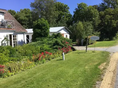 a house with a sign on the side of the road at Vejlen Bed & Kitchen in Vadum
