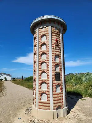 a brick tower sitting on the side of a road at Løgstør Camping in Løgstør