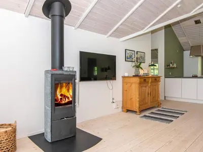 a fireplace in a living room with a tv at 6 person holiday home in Højslev-By Traum in Højslev