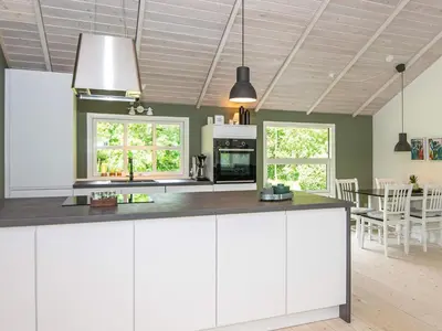 a kitchen with white cabinets and a counter top at 6 person holiday home in Højslev-By Traum in Højslev