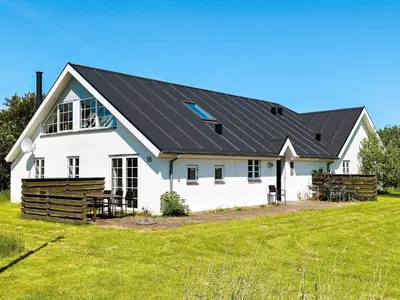 a white house with a black roof at 10 person holiday home in Thisted in Thisted