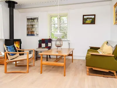 a living room with a table and chairs at 10 person holiday home in Thisted in Thisted