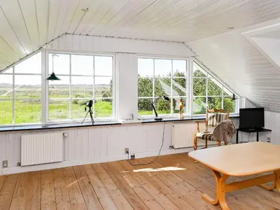 a room with windows and a table and a tripod at 10 person holiday home in Thisted in Thisted