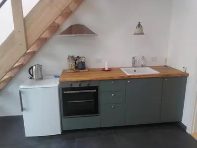 a kitchen with a sink and a counter top at Rikke og Franks Svineri in Lemvig