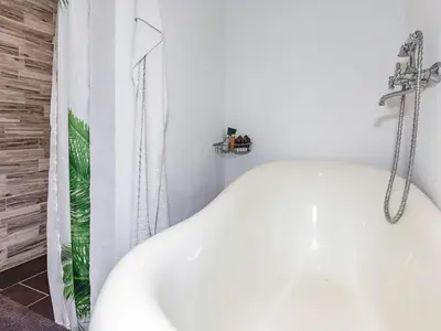 a white tub in a bathroom with a shower at 6 person holiday home in Løgstør in Løgstør