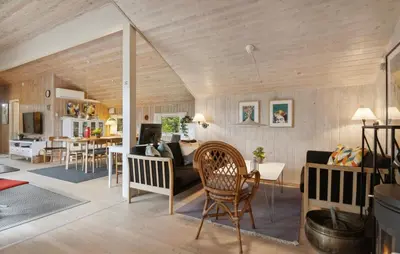 a living room with a couch and a table at Holiday Home Odavej Løkken Xi in Løkken