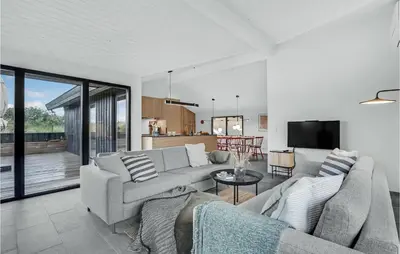 a living room with a couch and a table at Nice Home In Saltum With Kitchen in Saltum