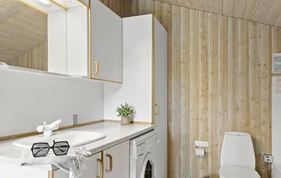 a bathroom with a sink and a toilet at Holiday Home Østersvej Fjerritslev Xii in Fjerritslev