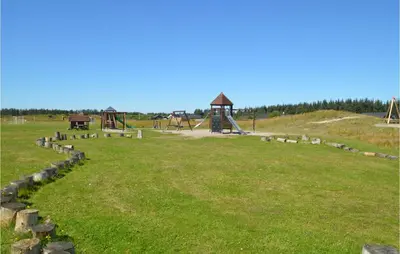 a park with a playground and a play structure at Holiday Home Kronvildtvej Brovst Ii in Brovst