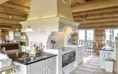 a kitchen with a sink and a stove at 9 Bedroom Beautiful Home In Lemvig in Lemvig