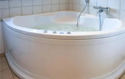 a bath tub filled with water in a bathroom at Holiday Home Klitengene Xi in Ulfborg