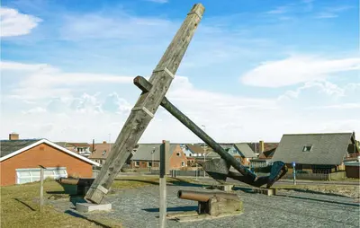 a sculpture of a large wooden pole at Holiday Home Klitengene Xi in Ulfborg