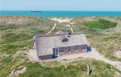 an aerial view of a house on the beach at Holiday Home Doblervej Harboøre Denm in Harboør