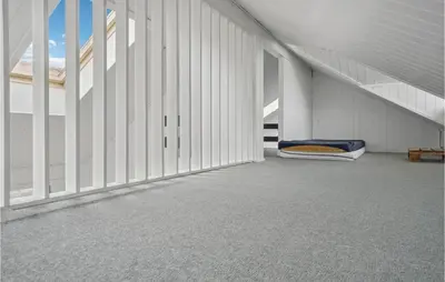 an empty room with a bed in a building at Stunning Home In Thisted With Sauna in Thisted