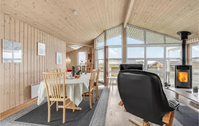 a dining room with a table and chairs at Holiday Home Hannesvej V in Vestervig