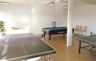 a room with a pool table and a ping pong table at Holiday Home Havnevej in Vestervig
