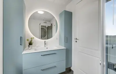 a bathroom with a sink and a mirror at Amazing Home In Thisted With Sauna in Thisted