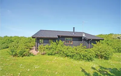 a house in the middle of a field at Holiday Home Hellesvej Vestervig Denm in Vestervig