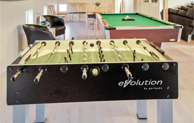 a ping pong table with a pool table at Holiday Home Klitstien Ii in Thisted