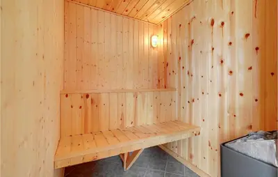 a wooden sauna with a wooden bench in it at Nice Home In Vestervig With Wifi in Vestervig